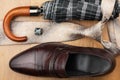 Classic mens shoes, tie, umbrella,cufflinks on the wooden floor