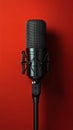 Classic microphone on a vibrant red background with sound wave pattern behind it Royalty Free Stock Photo