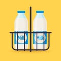 Classic milk bottles in wire carrier. Flat design modern vector