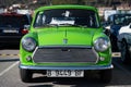 Classic Mini of green color parked in street