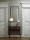 Classic modern hallway corridor interior with beige walls and white doors. Key table and a large mirror with sconces on the wall Royalty Free Stock Photo