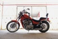 Classic motorcycle or bicycle in the parking lot near the garage