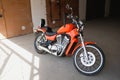 Classic motorcycle or bicycle in the parking lot near the garage