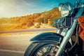Classic motorcycle parked on the edge of a country road Royalty Free Stock Photo