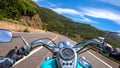 Classic motorcycle ride on a winding road in Sardinia