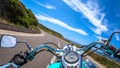 Classic motorcycle ride on a winding road in springtime