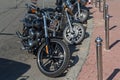 Classic motorcycles parked on a city street Royalty Free Stock Photo