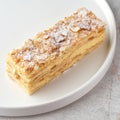 Classic Napoleon cake. Delicate and delicious homemade puff pastry dessert with custard. Close up.