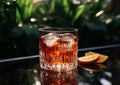 Classic negroni cocktail glass with ice and orange on glass table in summer lounge with palms.Macro.AI Generative