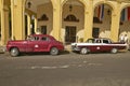 Classic old American cars parked in front of hotel in Old Havana, Cuba Royalty Free Stock Photo