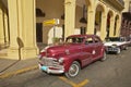 Classic old American cars parked in front of hotel in Old Havana, Cuba Royalty Free Stock Photo