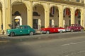 Classic old American cars parked in front of hotel in Old Havana, Cuba Royalty Free Stock Photo