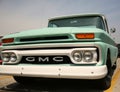 Classic Old pick up truck with aqua paint and white bumper
