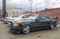 Classic old black coupe car Mercedes Benz 124 300 CE front and left side view parked Royalty Free Stock Photo