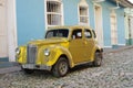 Classic old car on the colonial cobblestone streets Royalty Free Stock Photo