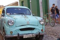 Classic old car on the colonial cobblestone streets Royalty Free Stock Photo