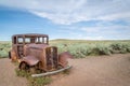 Classic Old Car decays in a meadow. Royalty Free Stock Photo