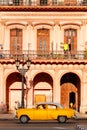 Classic old cars and colorful buildings in downtown Havana Royalty Free Stock Photo