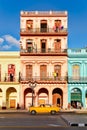 Classic old cars and colorful buildings in downtown Havana Royalty Free Stock Photo
