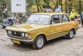 Classic old dark yellow Polish car Polski Fiat 125p parked