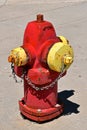 Classic red and yellow fire hydrant with a bit of rust Royalty Free Stock Photo