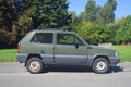 Old little green compact city veteran small car Fiat Panda I parked