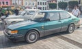 Classic old green private car Saab 900 parked