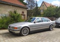 Classic old sedan car BMW 750 V12 front part and left side view parked