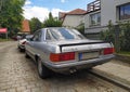 Classic old sedan car Mercedes Benz 500 SLC 5.0 litre rear and left side view parked