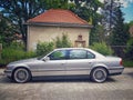 Classic old sedan luxury expensive car BMW 750 V12 left side view parked