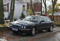 Classic old vintage veteran retro elegant sedan car black Jaguar XJ Executive parked