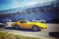 Classic old yellow veteran vintage historic muscle sports Chevrolet Corvette car driving Royalty Free Stock Photo