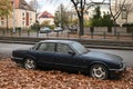 Classic old vintage veteran retro abandoned sedan car black Jaguar XJ Executive parked