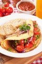 Classic omelete with toasted bread and cherry tomato
