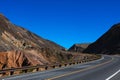 Classic panorama view of an endless straight road running through the barren scenery of the American Southwest Royalty Free Stock Photo