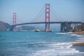 Classic panoramic view of famous Golden Gate Bridge seen from Baker Beach in beautiful summer sunny day with blue sky, San Royalty Free Stock Photo