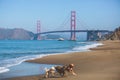 Classic panoramic view of famous Golden Gate Bridge seen from Baker Beach in beautiful summer sunny day with blue sky, San Royalty Free Stock Photo