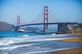 Classic panoramic view of famous Golden Gate Bridge seen from Baker Beach in beautiful summer sunny day with blue sky, San Royalty Free Stock Photo