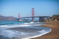 Classic panoramic view of famous Golden Gate Bridge seen from Baker Beach in beautiful summer sunny day with blue sky, San Royalty Free Stock Photo