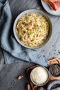 Classic pasta Carbonara, hearty Italian dish made with Spaghetti, egg, fried bacon, topped with grated Parmesan cheese and black p Royalty Free Stock Photo