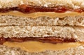 A Classic Peanut Butter and Strawberry Jelly Sandwich on Wheat B Royalty Free Stock Photo