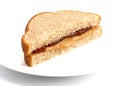 A Classic Peanut Butter and Strawberry Jelly Sandwich on Wheat B Royalty Free Stock Photo