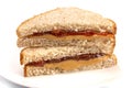 A Classic Peanut Butter and Strawberry Jelly Sandwich on Wheat B Royalty Free Stock Photo