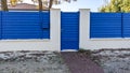 Classic pedestrian blue door metal home gate at entrance of house portal garden Aluminum Royalty Free Stock Photo