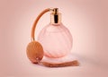 Classic perfume spray bottle with tassel in pink studio Royalty Free Stock Photo