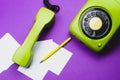 Classic phone with handset. pen with a note. office background. vintage green telephone with phone receiver. old communication Royalty Free Stock Photo