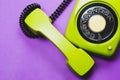 Classic phone with handset. vintage green telephone with phone receiver isolated on purple background. old communication Royalty Free Stock Photo