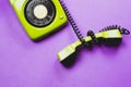 Classic phone with handset. vintage green telephone with phone receiver isolated on purple background. old communication Royalty Free Stock Photo