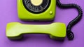 Classic phone with handset. vintage green telephone with phone receiver isolated on purple background. old communication Royalty Free Stock Photo