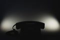 Classic phone silhouette in the dark. telephone with phone receiver. office background Royalty Free Stock Photo